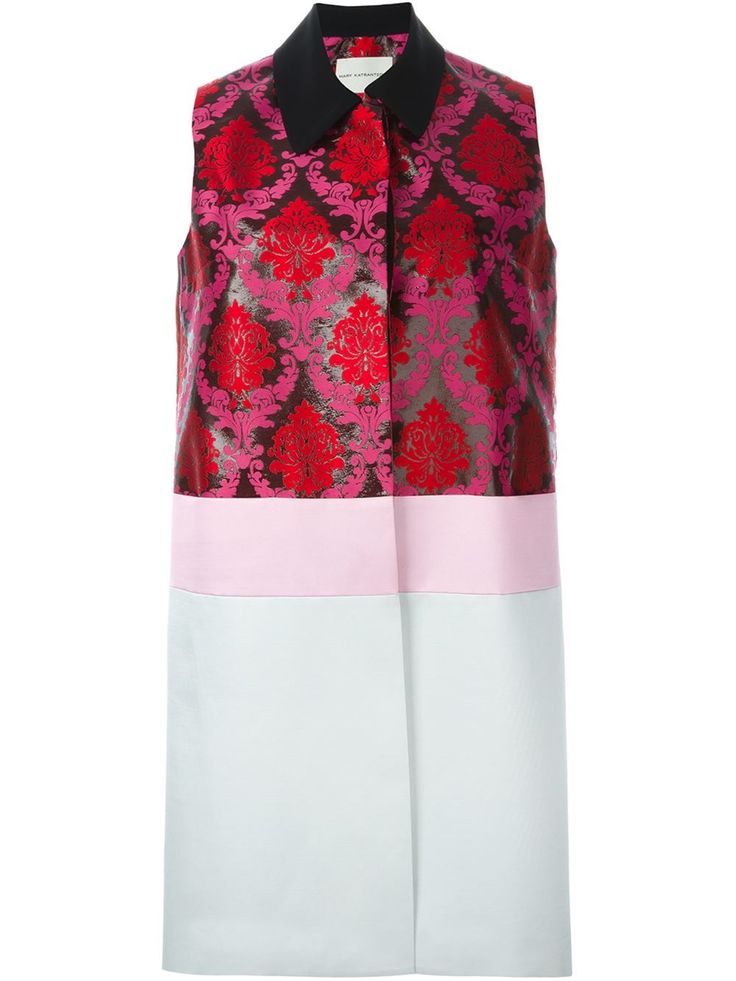 a kneelength sleeveless dress featuring a damask pattern on the top half, a pink horizontal stripe, and a white bottom half. the dress has a black collar.