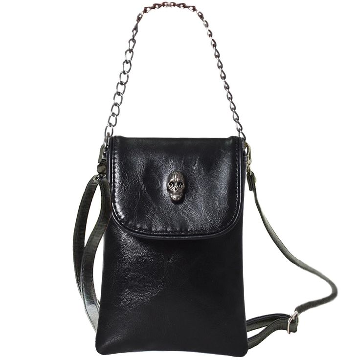 a black leather crossbody bag with a skull emblem and chain strap.
