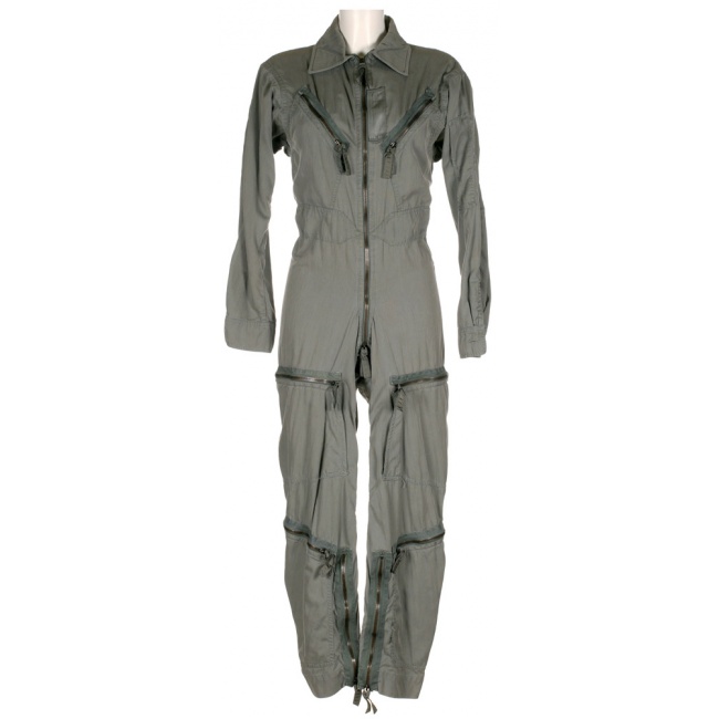 a green flight suit with numerous pockets and zippers, perfect for a pilot or military personnel.  the suit is hanging on a mannequin and the fabric is slightly wrinkled.
