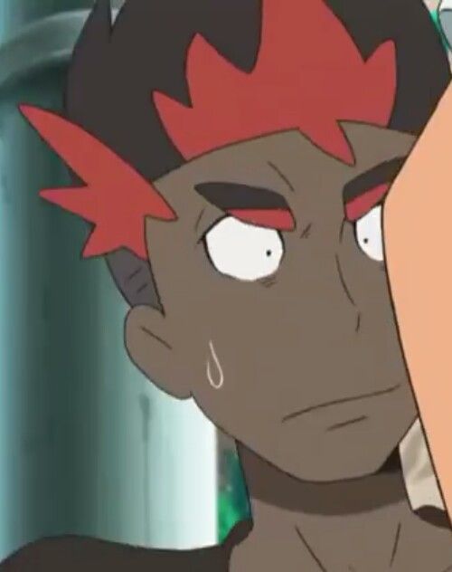 a closeup portrait of a cartoon anime character with red hair and black skin. he has wide, surprised eyes, an open mouth, and a worried expression. he is sweating and appears to be scared or nervous. the background is out of focus. the image appears to be taken from an anime show.