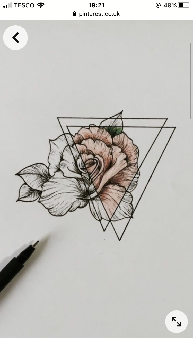 a pen and ink drawing on white paper. the drawing features a rose design partially colored in with pink. the rose is partially overlaid with a geometric pattern of triangles. a black finetipped pen is visible at the bottom of the image.