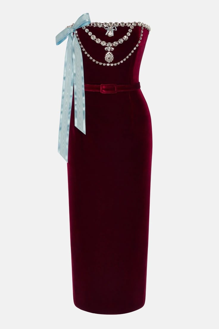 a strapless burgundy velvet cocktail dress with a matching velvet belt and a light blue ribbon bow. the dress has a jeweled neckline and a formfitting silhouette.