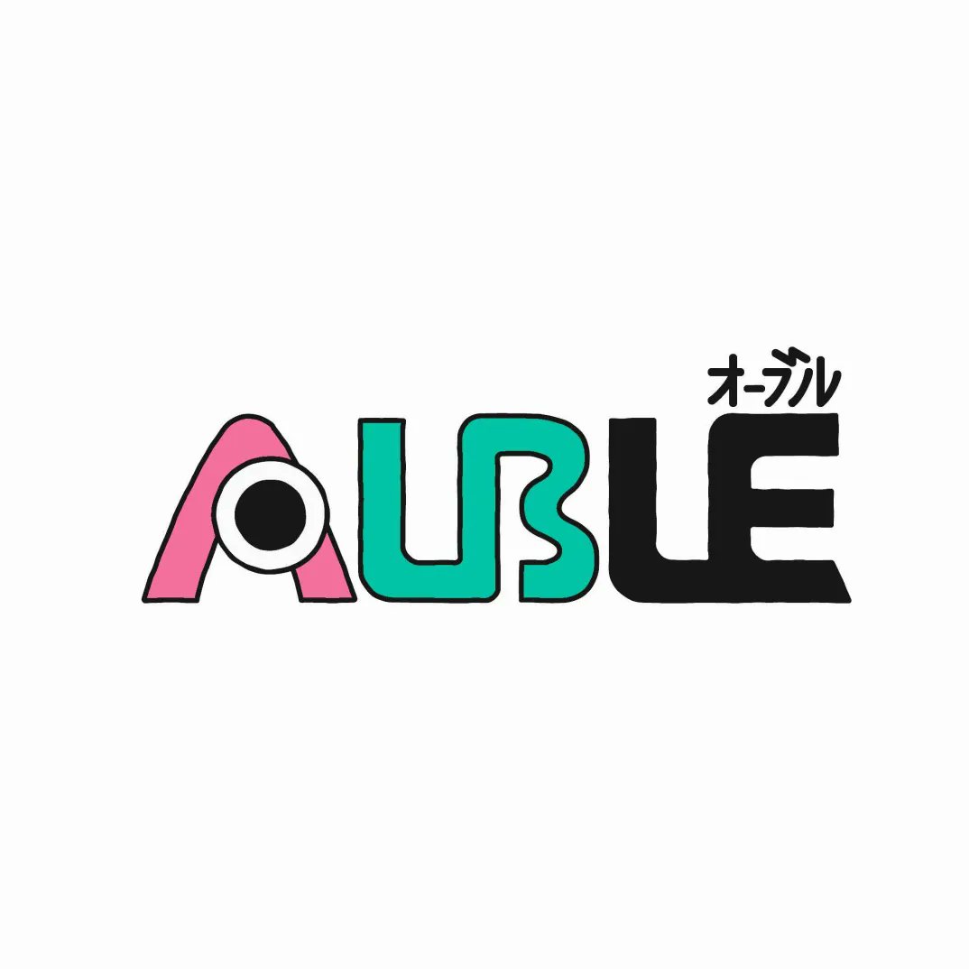 the image features a logo with the word "auble" written in large, stylized letters. the "a" is pink and has a circle for the hole. the "ubl" is teal and the "e" is black. there is small, stylized japanese text above the "le" which reads "original". the logo appears on a white background.