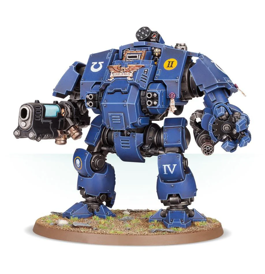 this is a picture of a  blue space marine dreadnought from warhammer 40,000, a miniature wargame. the dreadnought has a heavy bolter, twin heavy bolters, and a missile launcher. it has the symbol of the imperial fists chapter on it. the image is shot from a slightly raised angle, to show the full body of the dreadnought.