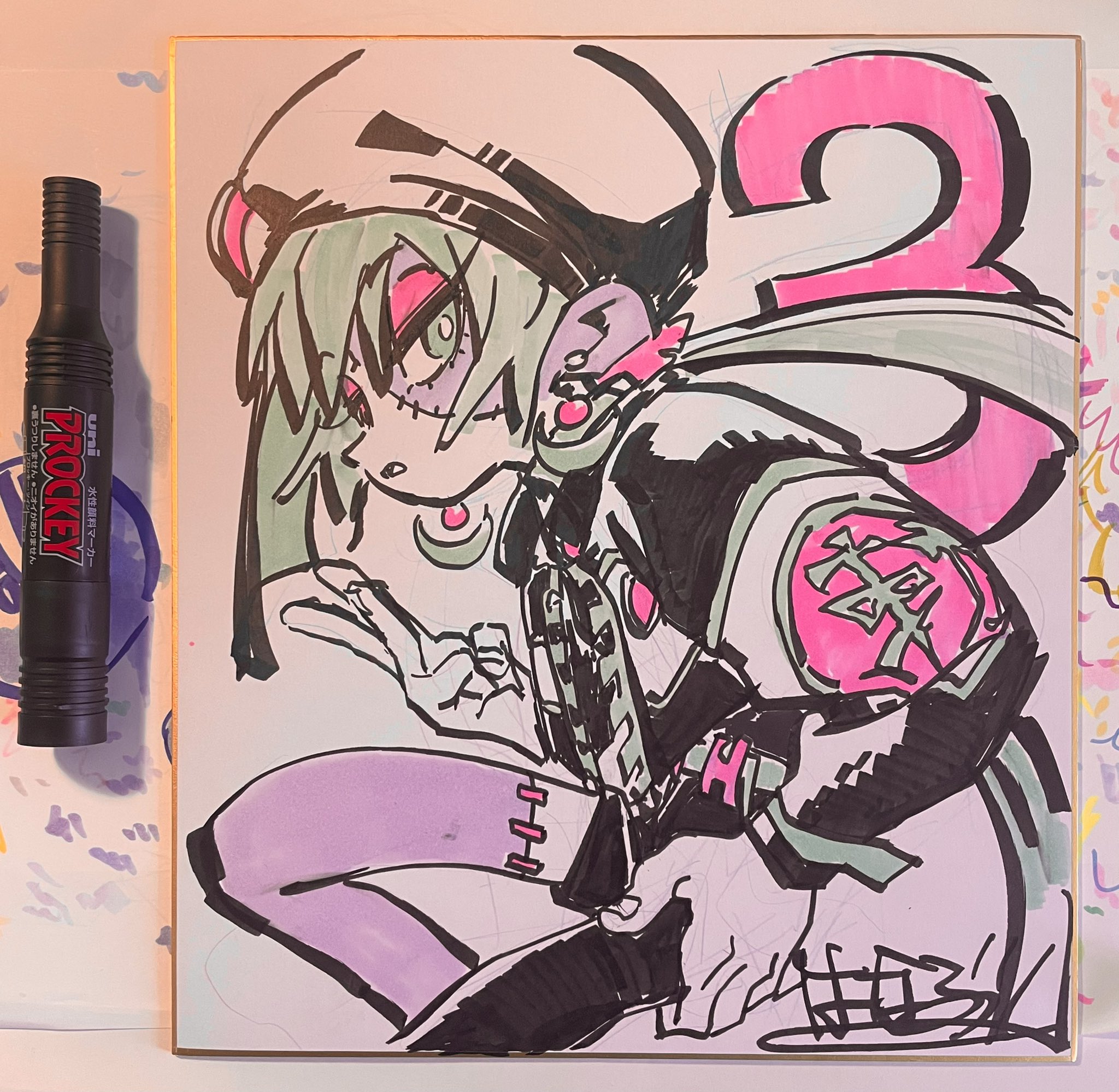 this image shows a black and white drawing of a girl character, likely from an anime or manga series. the drawing has been done with a black marker on a white surface, and a black marker pen is shown alongside the drawing. the drawing is detailed and expressive, capturing the character's personality and style. the image is welllit and the drawing is in sharp focus.