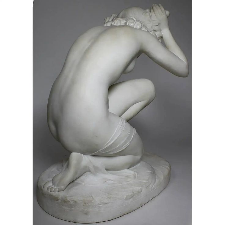 a white marble sculpture of a nude woman. she is seated on a pedestal, with her head resting on her hands. the sculpture is very detailed, with a smooth and realistic finish.
