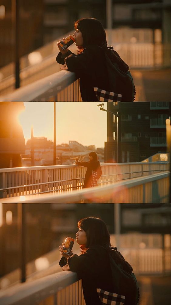 the image features a young woman standing on a bridge during sunset. she is wearing a black jacket and a checkered bag. in the first and third photos, she is drinking from a can while leaning on the railing. the second photo shows her from a distance, walking away from the camera. the warm, golden light of the setting sun creates a peaceful and contemplative atmosphere.