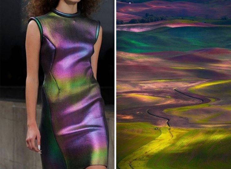 a woman in a shimmering iridescent dress, with hues of purple, green, and blue, stands against a backdrop of rolling hills, similar in color and texture to her dress. the hills are a vibrant tapestry of greens and purples, with a winding path snaking through the landscape. sunlight casts long shadows across the scene, adding to the dramatic and evocative nature of the photograph. the overall effect is one of beauty, elegance, and a connection between the woman and the natural world.