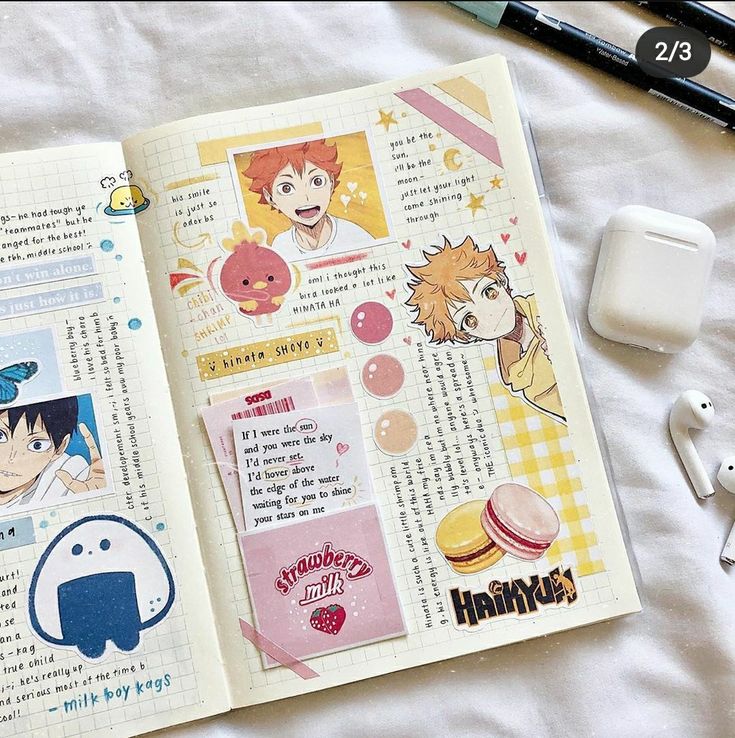 the image is a closeup of a bullet journal spread featuring the character hinata shoyo from the anime/manga series haikyuu. the spread is decorated with stickers, washi tape, and other embellishments.  it includes a quote about hinata, a drawing of hinata and the chibi shrimp sticker, and a strawberry milk sticker. there are also some writing about the character and a quote about being the sun and the sky. in the background, there are some airpods and a pen, along with some blank pages.