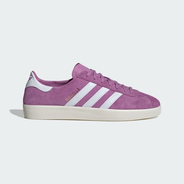 a pair of purple adidas gazelle sneakers with white stripes and a white sole. the shoes are a classic style and are popular for both men and women.