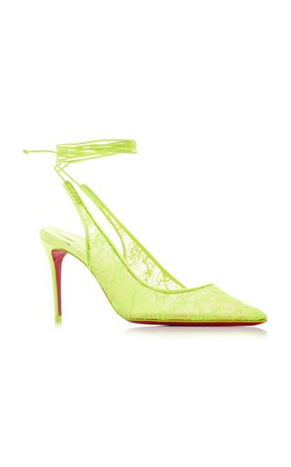 a pair of yellow lace high heels with a red bottom. the shoes are on a white background and are angled slightly to the right. the lace is delicate and intricate, and the heel is tall and slender.  the shoes are elegant and stylish, and would be perfect for a special occasion.
