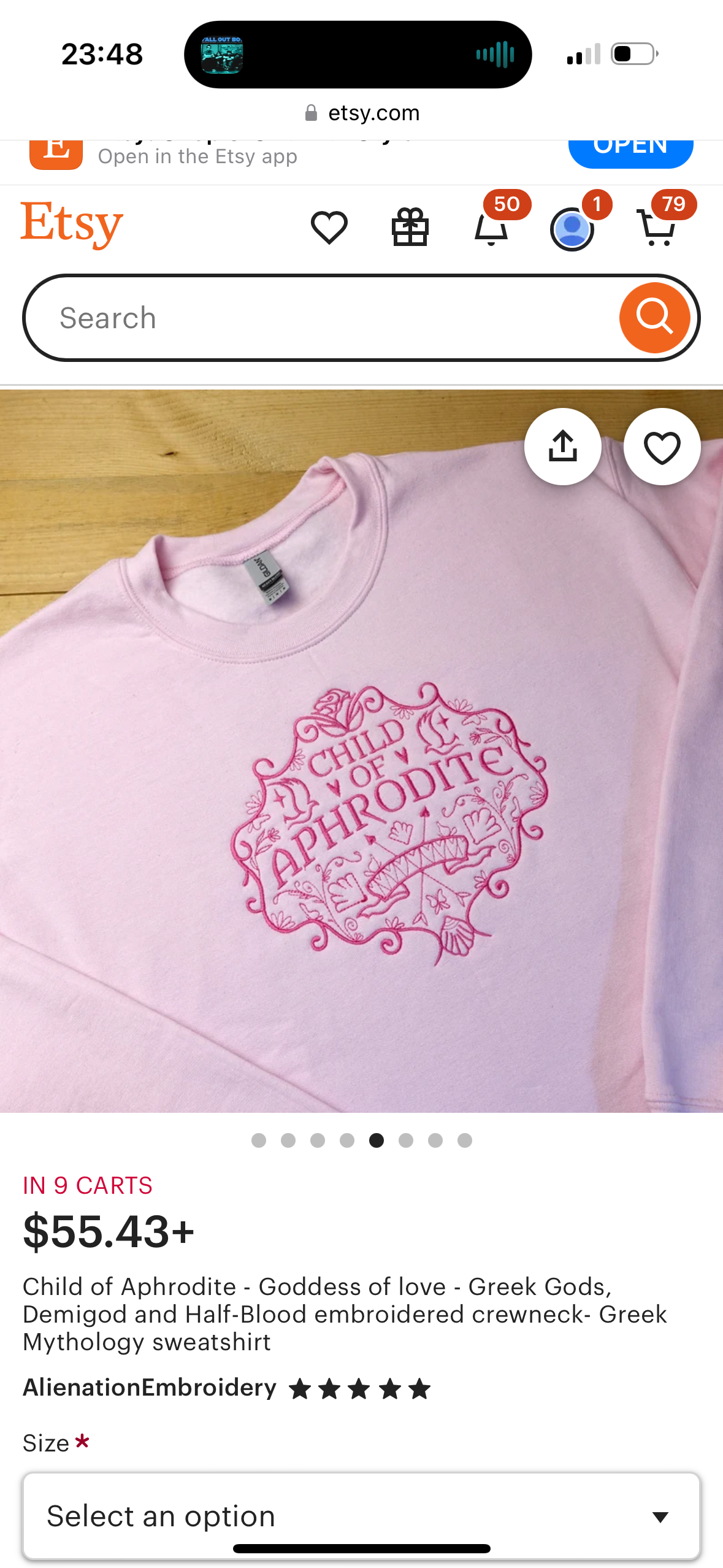 a pink sweatshirt with the words "child of aphrodite" embroidered on the front. it has a beautiful, vintagestyle design with intricate details. the sweatshirt is made of highquality materials and is sure to be a favorite in your wardrobe.
