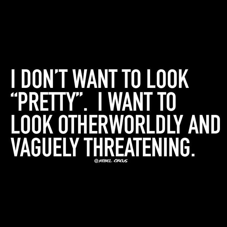 the image shows a black background with white text that says "i don't want to look "pretty". i want to look otherworldly and vaguely threatening." below the text, it is written "@rebel circus".