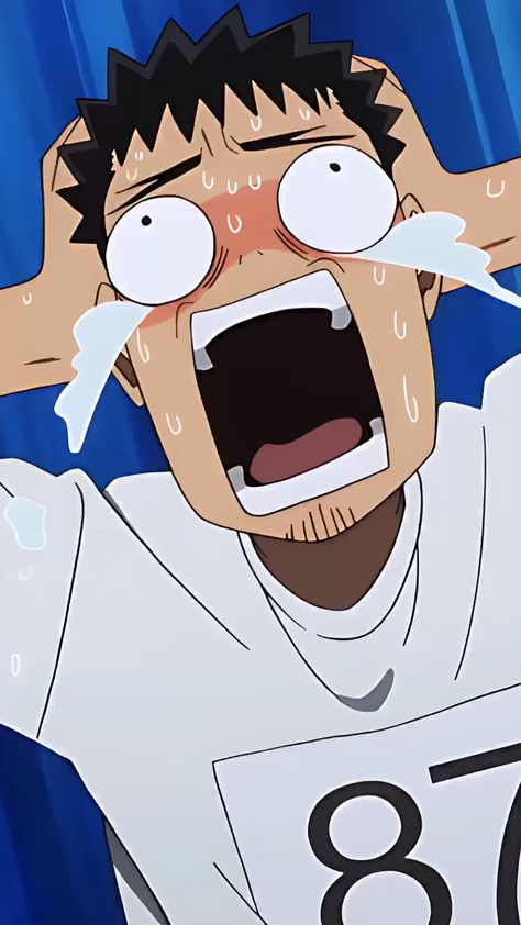 a cartoon drawing of a man with short black hair and stubble wearing a white shirt with the number 87 on it is shown crying and with wide eyes and an open mouth against a blue background.