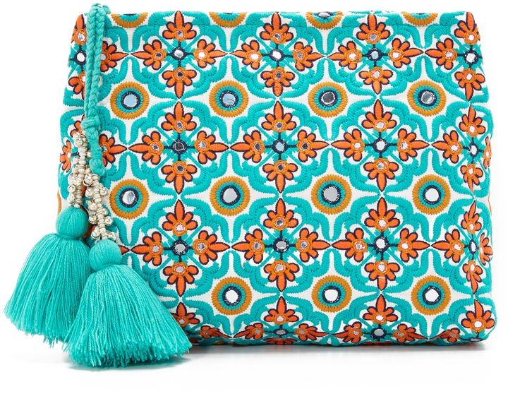 this is a picture of a turquoise clutch bag with orange and white floral embroidery. the clutch is adorned with a beaded tassel and has a mirrorlike design, which is an intricate pattern. the bag is made of highquality fabric and is very stylish.