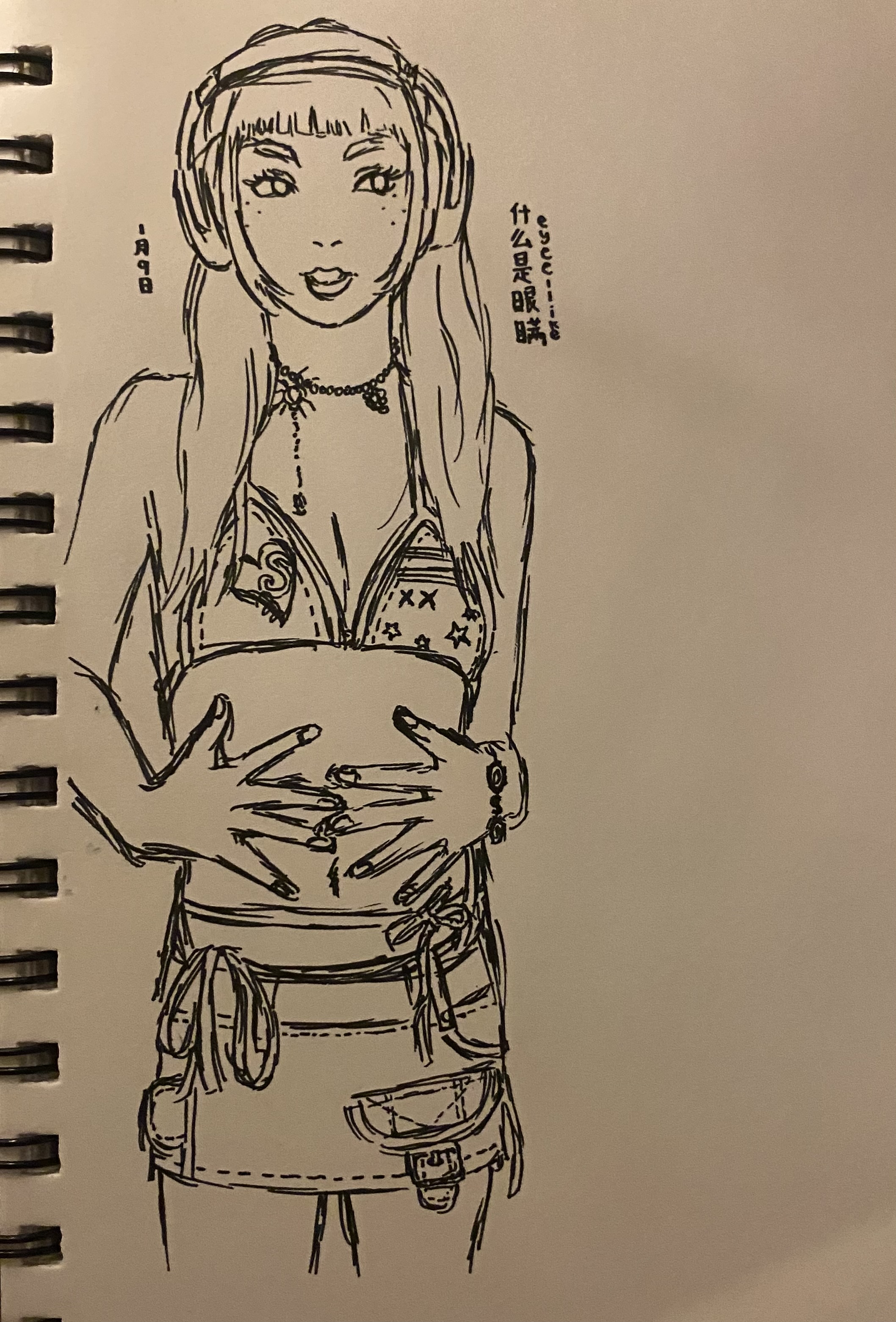 the image is a black and white ink sketch of a stylized female figure.  she has long hair with bangs, is wearing large headphones, a starpatterned bikini top, a short skirt with pockets and detailing, and various accessories including a necklace and bracelets. her hands are clasped around her midriff. the style is reminiscent of anime or manga, with a slightly rough, handdrawn quality.  there's some japanese text visible in the upper right corner. the overall aesthetic is casual and slightly edgy.