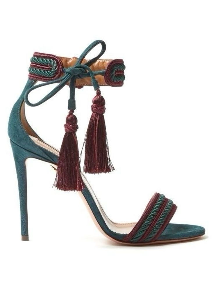 this is a photo of a pair of women's high heeled sandals. the shoes are a teal suede with a burgundy tassel. the straps are woven with teal and burgundy. the sandals have a high heel and an ankle strap.