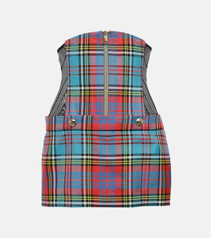 a strapless minidress featuring a plaid tartan pattern in shades of blue, red, black, yellow, and white. it has a gold zipper down the back and buttons at the waist. the sides of the dress appear to have a black mesh panel.