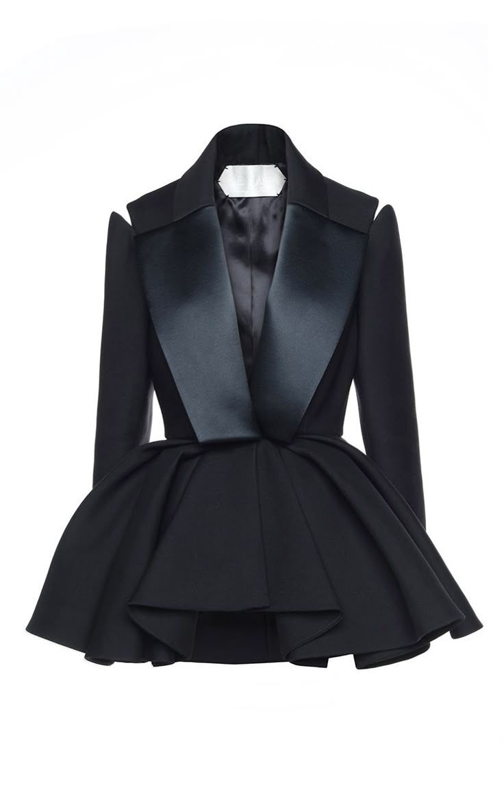 a black peplum blazer with cutout shoulders is displayed against a white background. the blazer has a satin lapel, a visible white label inside the collar, and a dramatically flared peplum waist.