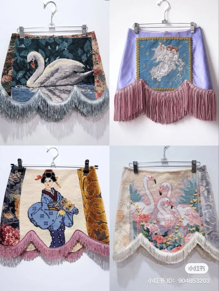 four tapestry mini skirts hang on hangers. the top left skirt features a swan, the top right features angels, the bottom left features a geisha, and the bottom right features flamingos. each skirt has a fringe along the bottom.