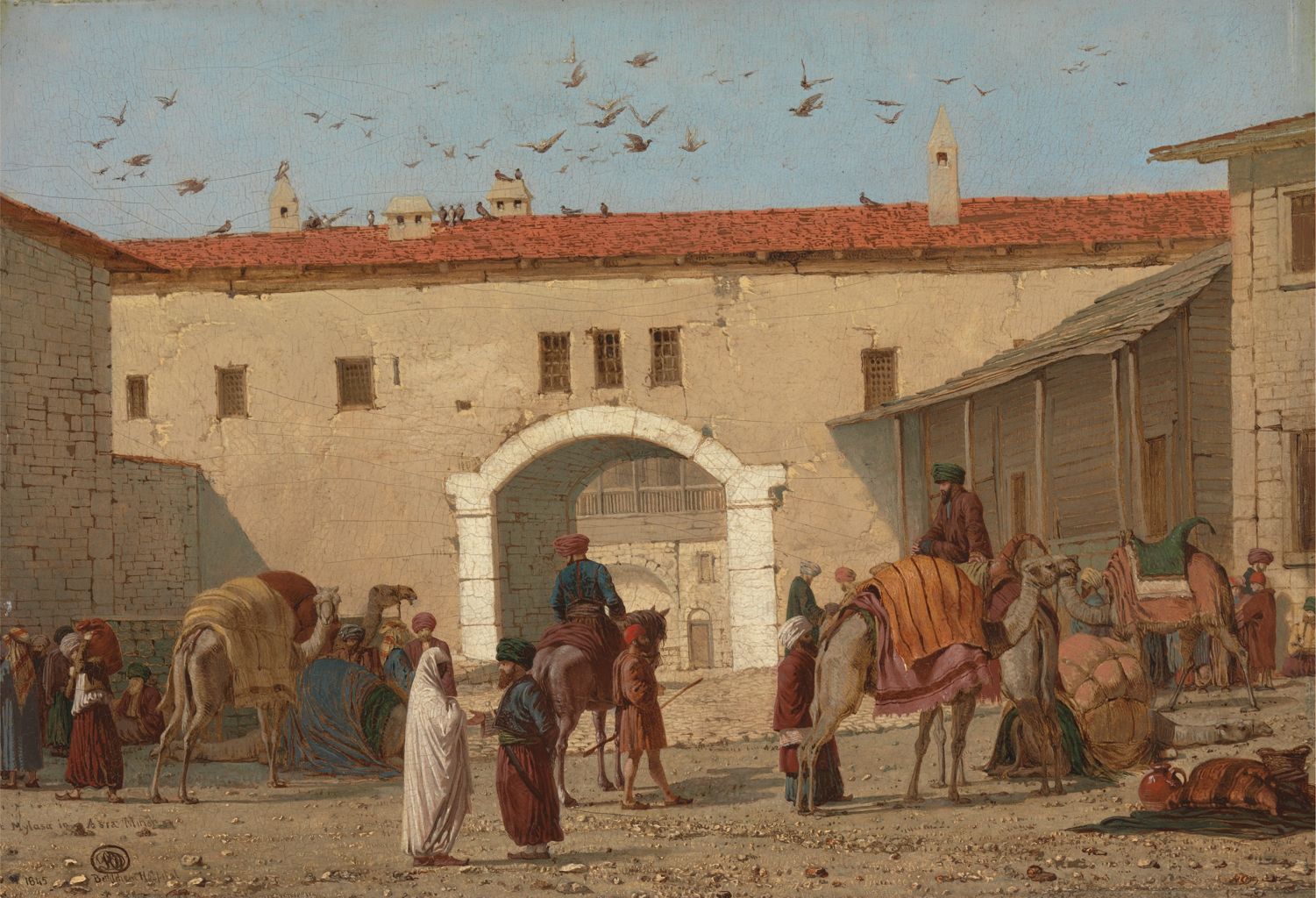 the painting depicts a bustling market scene in the middle east. several camels laden with goods are surrounded by people dressed in traditional clothing. an archway leads into a building complex with a courtyard. birds fly above the scene. the painting captures the orientalist style with attention to detail in the architecture and clothing. the scene is an outdoor urban setting with a town square atmosphere.
