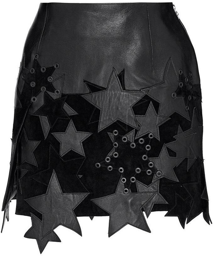 a black leather mini skirt featuring star appliques and grommets. the skirt has a decorative, edgy design with varying textures and patterns.