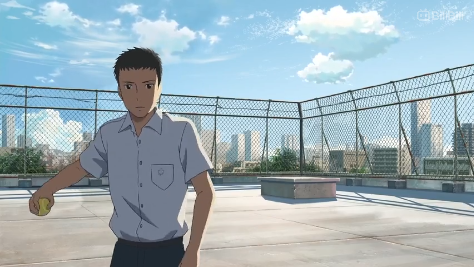 the image shows a young man in a school uniform standing on a rooftop on a sunny day. he is holding a baseball and appears to be looking into the distance at the urban cityscape spread out before him. the perspective is at eye level, giving a sense of the character's point of view. the lighting is bright and natural, casting shadows that highlight the figure against the rooftop. the overall feeling is one of quiet contemplation and perhaps a sense of yearning.