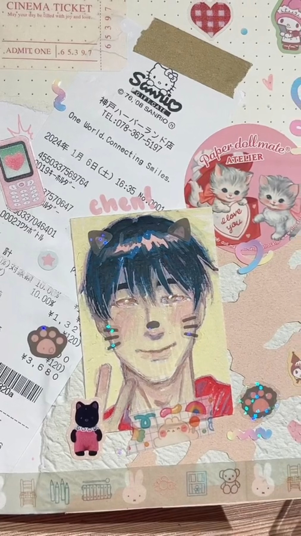 a closeup shot of a sticker featuring a young man with black hair and cat ears. the sticker rests on top of a collection of stationery and receipts, suggesting a personal collection or scrapbook. the sticker's art style is reminiscent of anime and manga, and the character exudes a soft and charming aura. the overall aesthetic leans towards a pastel color scheme with cute and whimsical elements.