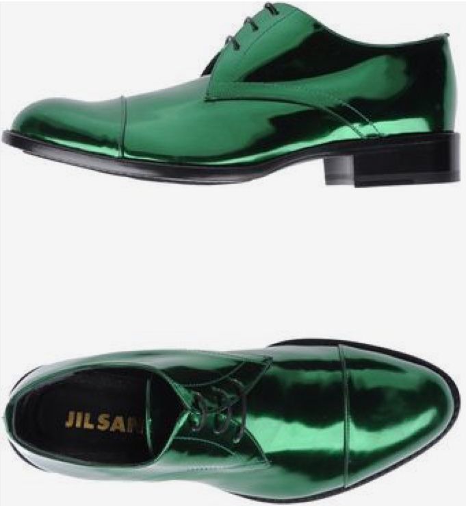 the image shows a pair of men's jil sander green metallic leather oxfords. the shoes are a vibrant green with a high shine, pointed toe, and laceup closure.  they are shown from two angles: a topdown view of a single shoe and a slightly elevated view of the shoe on a white background. the brand name "jil sander" is visible inside the shoe in the lower view.