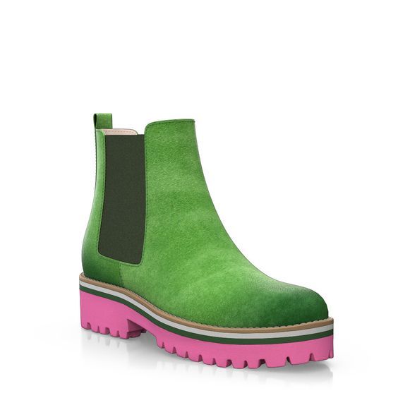 a pair of green suede ankle boots with a pink platform sole. the boots have a classic chelsea boot design with elastic side panels and a pullon tab. the platform sole is chunky and gives the boots a trendy look.
