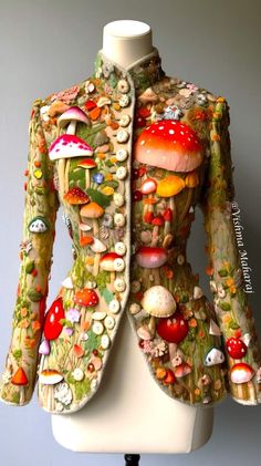 a closeup shot of a unique and whimsical jacket, adorned with intricately embroidered mushrooms of various sizes and colors. the jacket is a work of art, blending fashion and nature in a surreal and captivating way. the vibrant reds, greens, and whites of the mushrooms create a stunning visual contrast against the textured fabric. the buttons, which look like miniature buttons, add to the overall charm of the piece. the jacket is a testament to the creativity and skill of the designer, showcasing a unique and daring fashion statement. the overall style is playful yet elegant, making it a true eyecatcher.