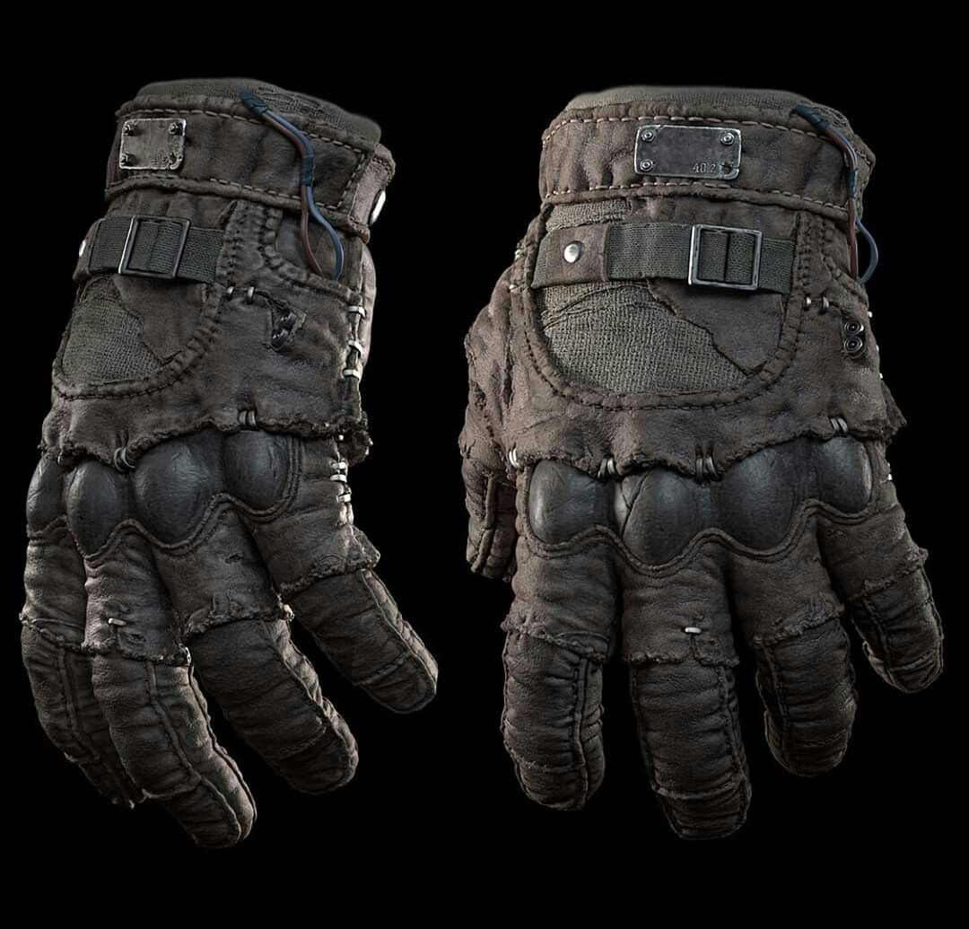a pair of dark, weathered, leather tactical gloves with thick padding and a strap around the wrist. the gloves appear to be used and worn, with areas of dirt and fading. they are worn in a way that appears to be ready for combat.