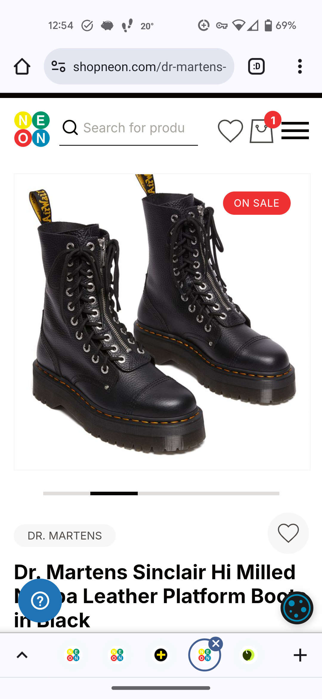 a pair of black dr. martens sinclair hi milled boots are on display. the boots feature a platform sole, lace up front, and a side zipper. the boots are black leather and have a yellow stitching on the sole. the boots are on sale.