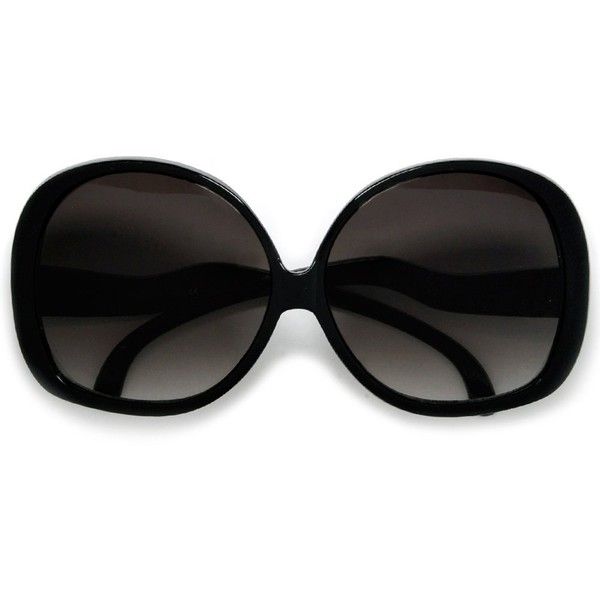 the image shows a pair of large, round black sunglasses with darktinted lenses. the frames are thick and rounded, creating a retro or vintage aesthetic. the lenses are dark, providing ample shade. the glasses are presented on a white background.