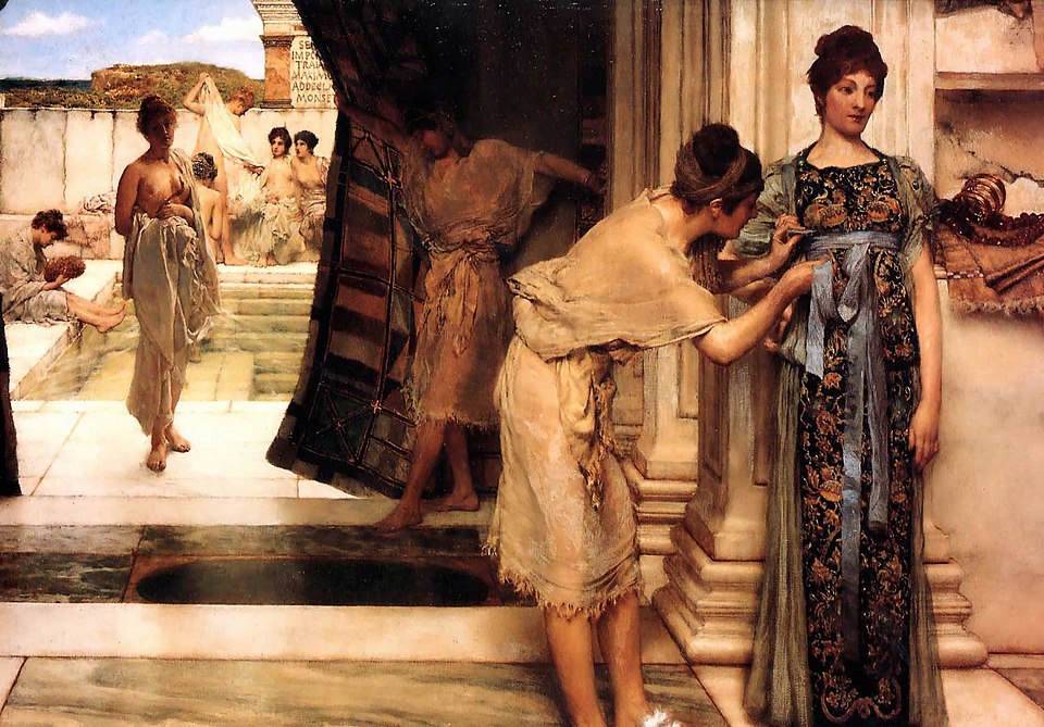 this is a painting depicting women in a classical or roman bath house setting. several women are present, some undressed or partially dressed, near a pool or bathing area in the background. a dark curtain or tapestry is being held aside by a figure, leading to a scene in the foreground where one woman is being fitted or dressed by another. the woman being dressed wears a patterned gown with a blue sash, while the other is in simpler attire. the style of the painting is reminiscent of victorian interpretations of antiquity.