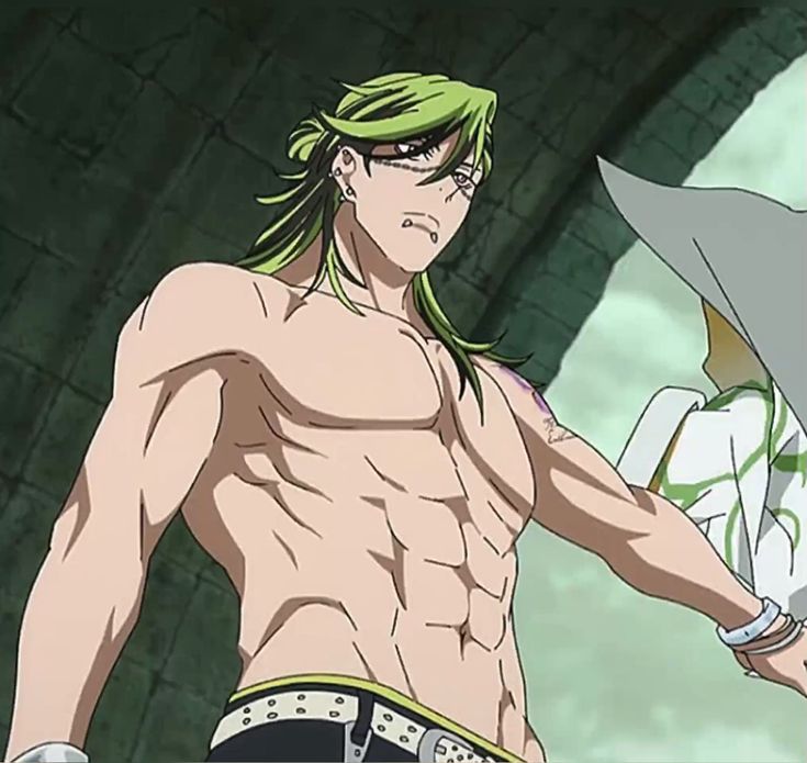 the image shows a muscular anime man with bright green hair. he has a tattoo on his left shoulder and is wearing black pants with a silver chain. the background depicts a stone building.
