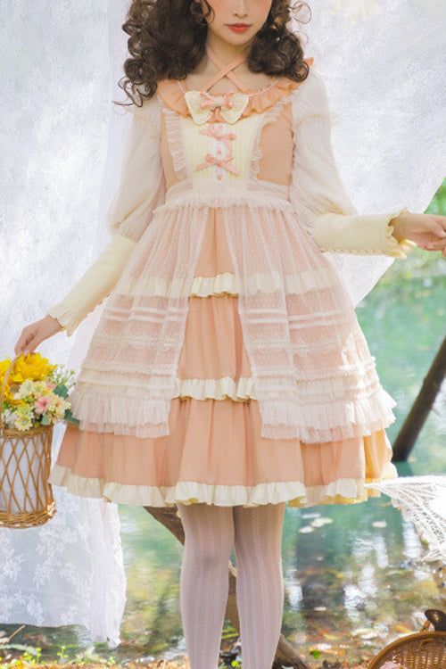 a young woman wearing a flowing, peachcolored lolita dress poses outdoors in a garden setting. the dress features intricate lace details, ruffles, and a delicate bow at the neckline. the soft, natural lighting enhances the dreamlike quality of the image.