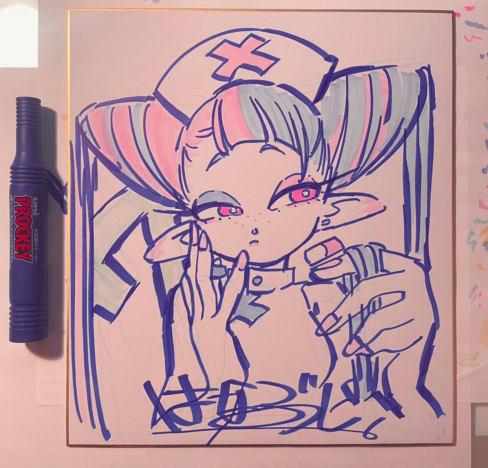 this is a brightly lit, indoor shot of a whiteboard sketch of an anime girl dressed in a nurse outfit applying makeup. she has pink and blue pigtails and is gazing directly at the viewer. her left hand holds a tube, while her right hand holds a compact.  the drawing is signed in the lower right corner in black marker, and a blue marker leans against the board to the left.  the background surrounding the artwork features colorful confetti.