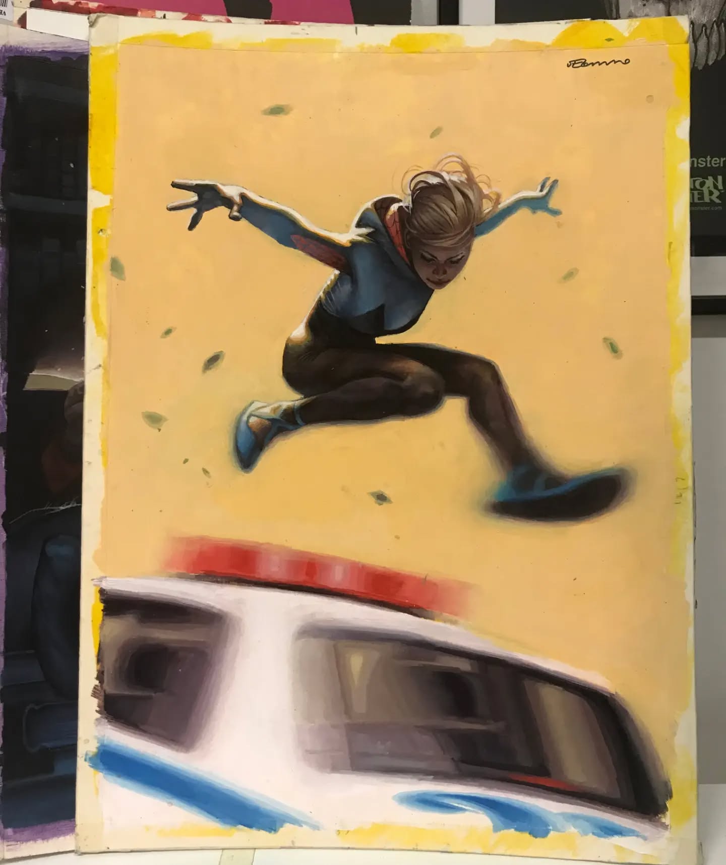 a comic book illustration of a girl jumping over a police car, set against a yellow background with falling leaves. the girl is depicted in midair, with arms outstretched, wearing a suit with a star emblem. the police car is drawn below, indicating motion blur. the artwork is signed "ben caldwell."
