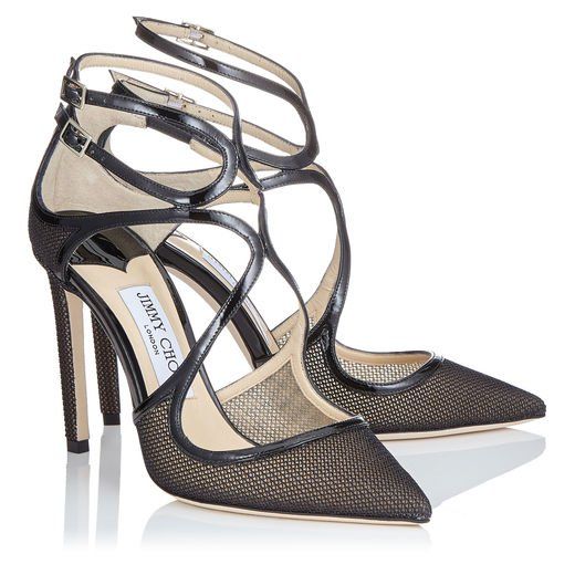 a closeup shot of a pair of jimmy choo women's high heels. the shoes are black with a mesh upper and patent leather accents. they have crisscross straps and pointed toes. the shoes are elegant and stylish, and appear to be made of highquality materials.  one shoe is slightly in front of the other, showing the detail of both.