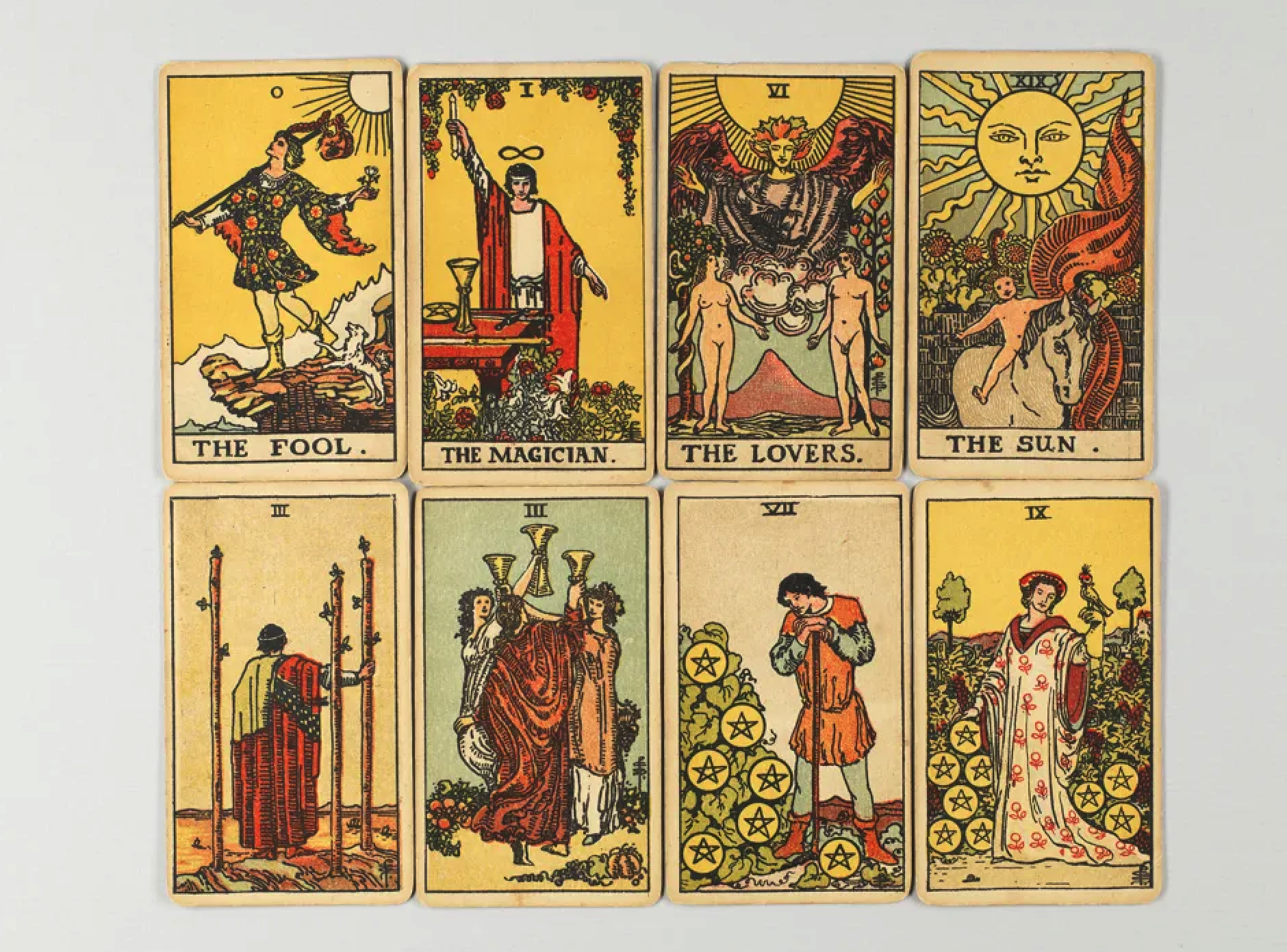 a spread of tarot cards, showing the major arcana: the fool, the magician, the lovers, the sun, the empress, strength, the chariot, justice, the hermit, the wheel of fortune, the hanged man, death, temperance, the devil, the tower, the star, the moon, the sun, judgment, the world.