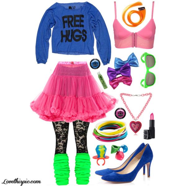 the image features a collage of 80s fashion elements. a blue longsleeved shirt with "free hugs" printed on it is displayed above a tiered pink tulle skirt. below the skirt are black lace stockings with neon green leg warmers. to the right, there are various accessories including a pink crop top, orange hair extensions, colorful bows, green sunglasses, a pink heart necklace, colorful bracelets, candy rings, lipstick, and blue high heel shoes. the overall style is reminiscent of 1980s fashion trends with its bright colors and playful accessories.