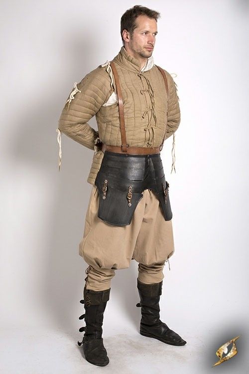 a man dressed in medieval armor, standing in front of a white background. he's wearing a padded leather jacket, a leather belt with metal buckles, leather pants, and leather boots.  he has a serious expression on his face.