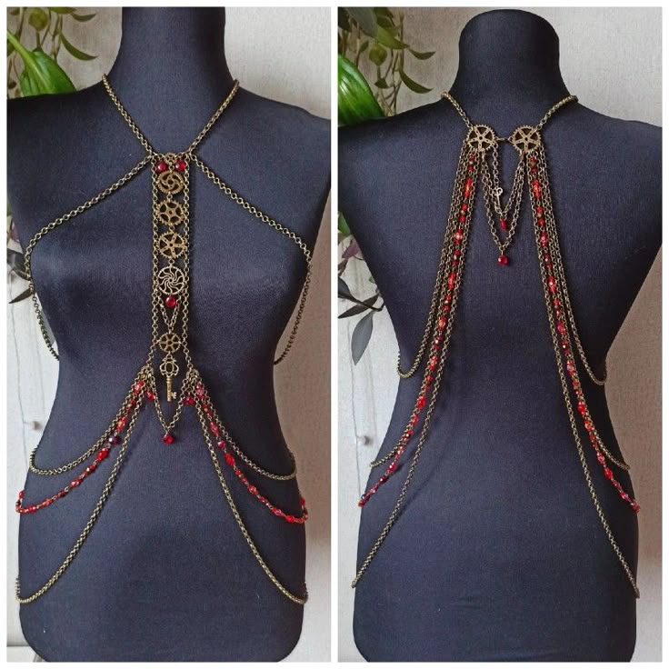 the image shows a front and back view of a steampunkstyle body chain displayed on a black mannequin. the jewelry features bronzecolored chains, gears, keys, and red beads. the front view has a central vertical chain with gears and a key pendant, while the back view features two gears connecting chains with red beads. the body chain drapes across the torso and back.