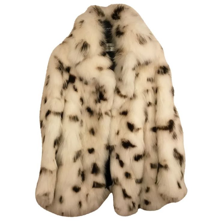 a white fur coat with brown spots, unbuttoned and hanging, showcasing a luxurious winter outerwear option.