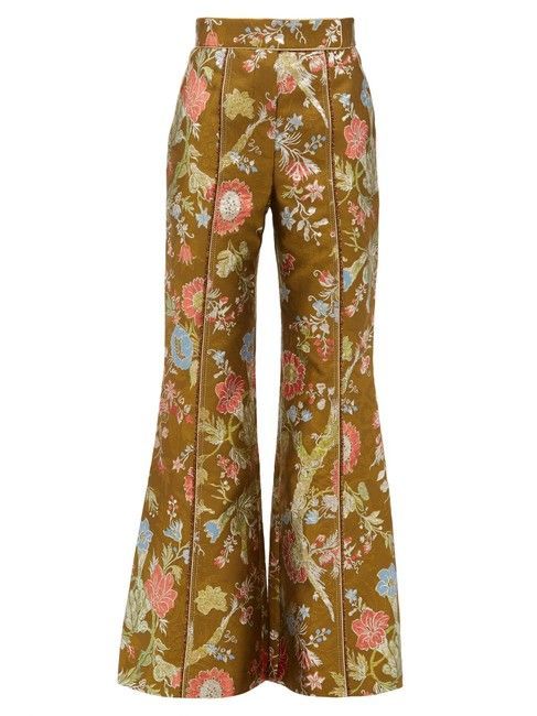 the image shows a pair of brown pants with a flared leg and a floral pattern.