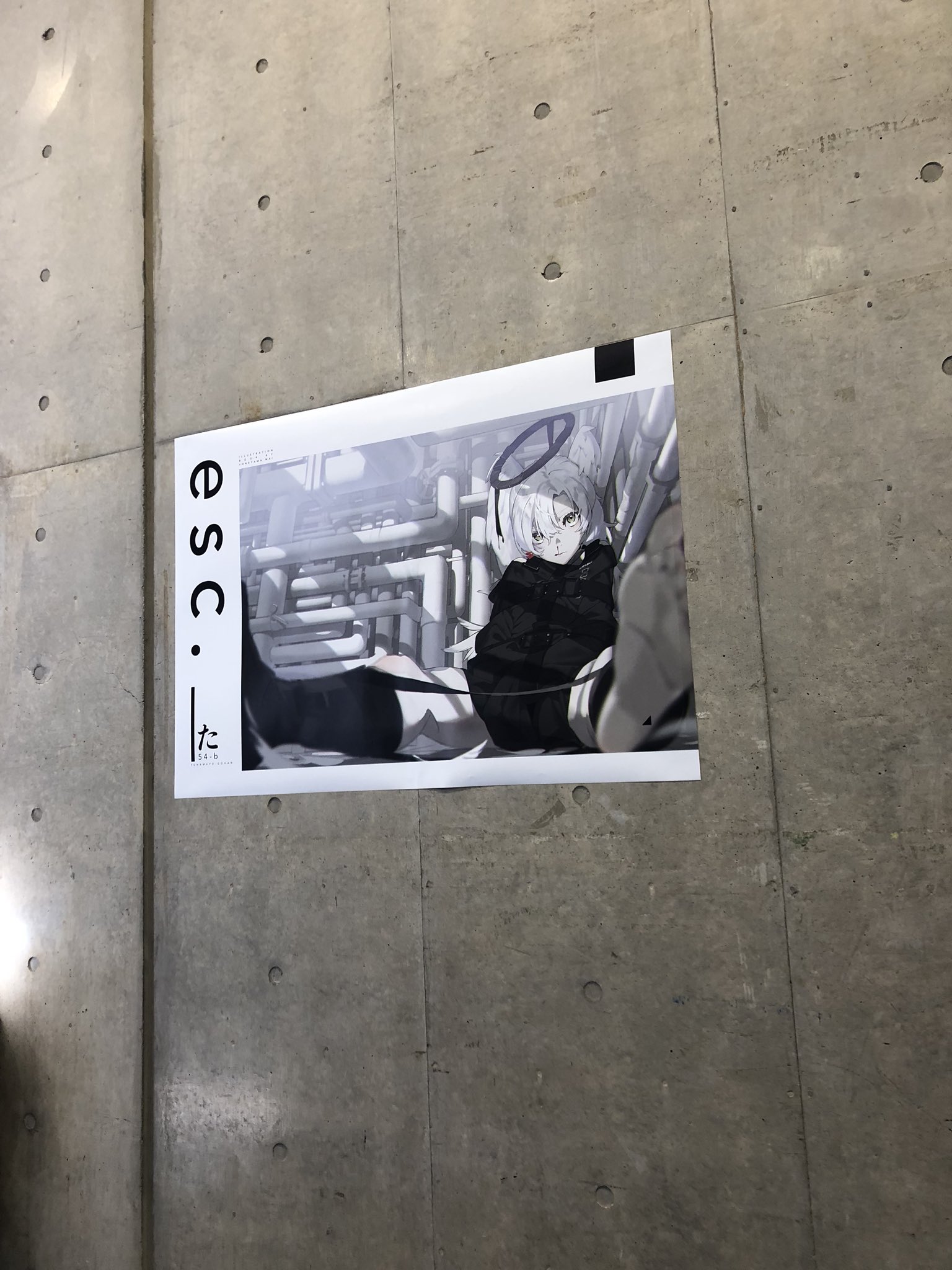 an animestyle poster on a concrete wall. the poster features a drawing of a girl with white hair and a halo sitting in an industrial setting. she is wearing a black outfit and looking at the viewer. the poster has the text "e s c c." written vertically on the left side.