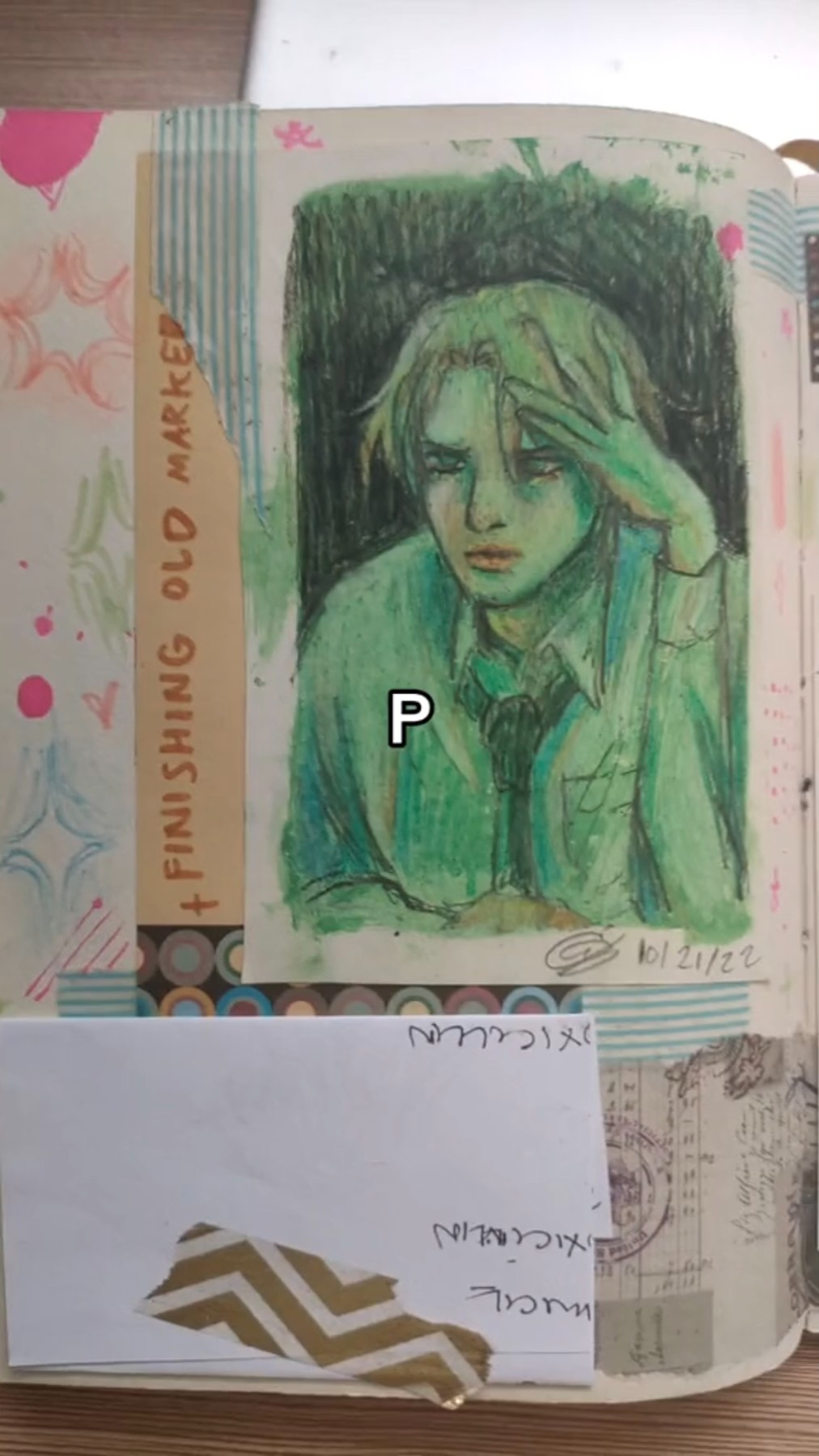 a sketchbook page with a drawing of a young man's portrait. the person's face is partially obscured by their hand, which appears to be resting on their head. the image is drawn in shades of green, blue, and black, and appears to be created with colored pencils. there is a letter "p" written at the bottom of the drawing, and a date written at the bottom of the page. the page is filled with other markings and sketches, likely from previous drawings or journal entries. the background appears to be white paper with a green, blue, and black striped border.  the image is taken from a topdown perspective, showing the entire sketchbook page.