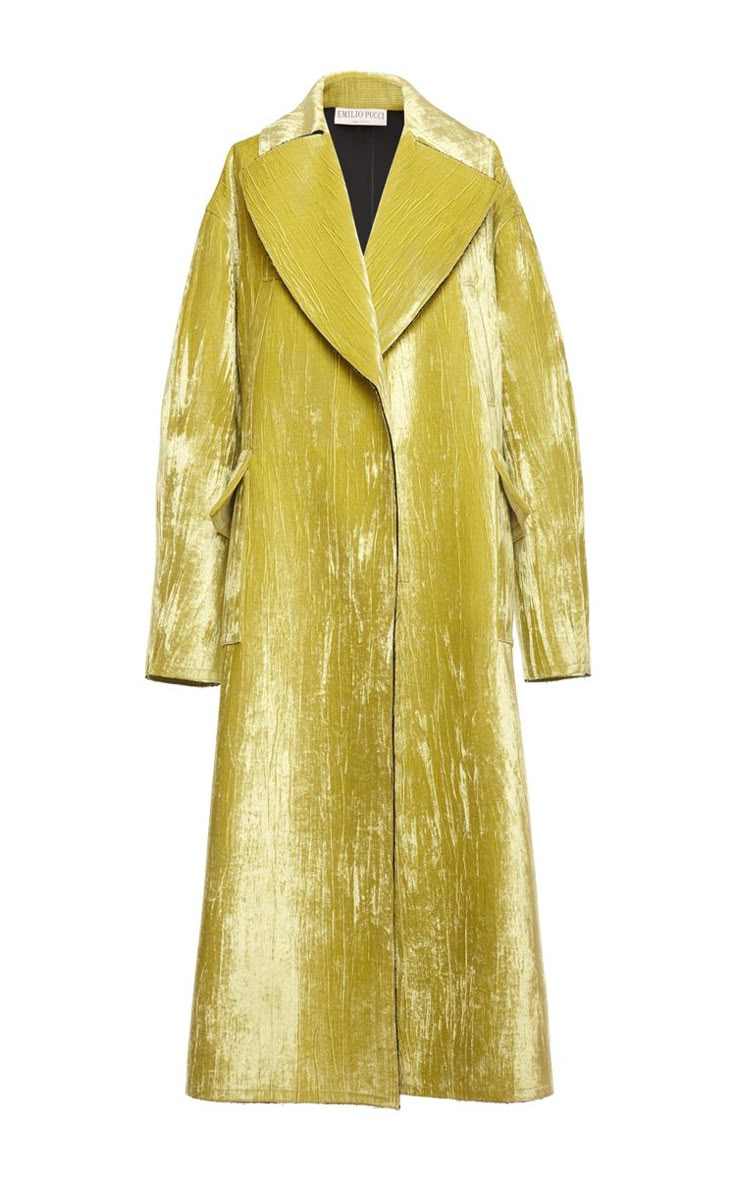 a fulllength studio shot of a yellow velvet coat. the coat has long sleeves, a large collar, and lapels. the coat is formal wear and is a singlebreasted style. the coat is photographed on a white background.