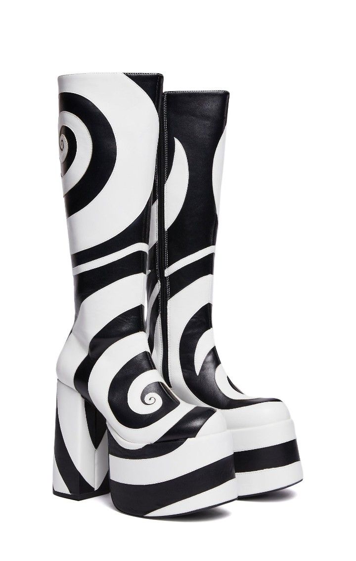 two black and white spiral pattern platform boots are shown. the boot on the left is slightly forward. they are knee high boots with high heels.
